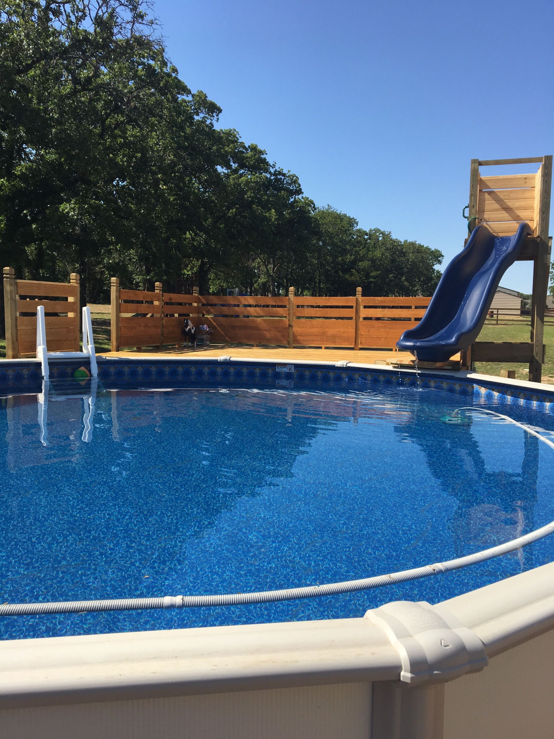 Above Ground Swimming Pool Slides
 Beachy Pool deck with slide