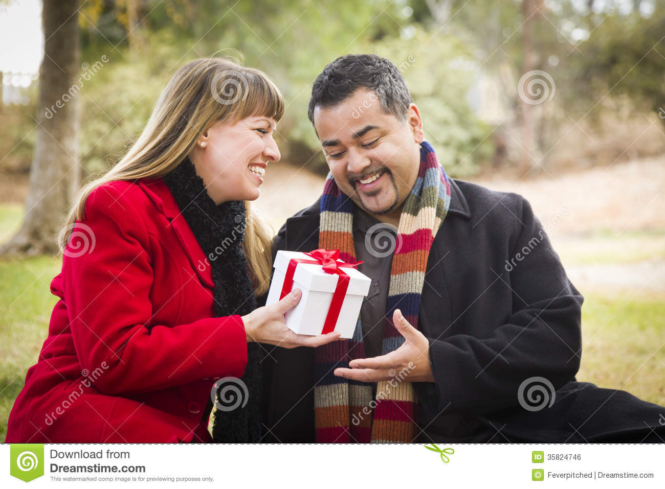 Christmas Gift Ideas For Young Married Couples
 Mixed Race Couple Sharing Christmas Valentines Day Gift
