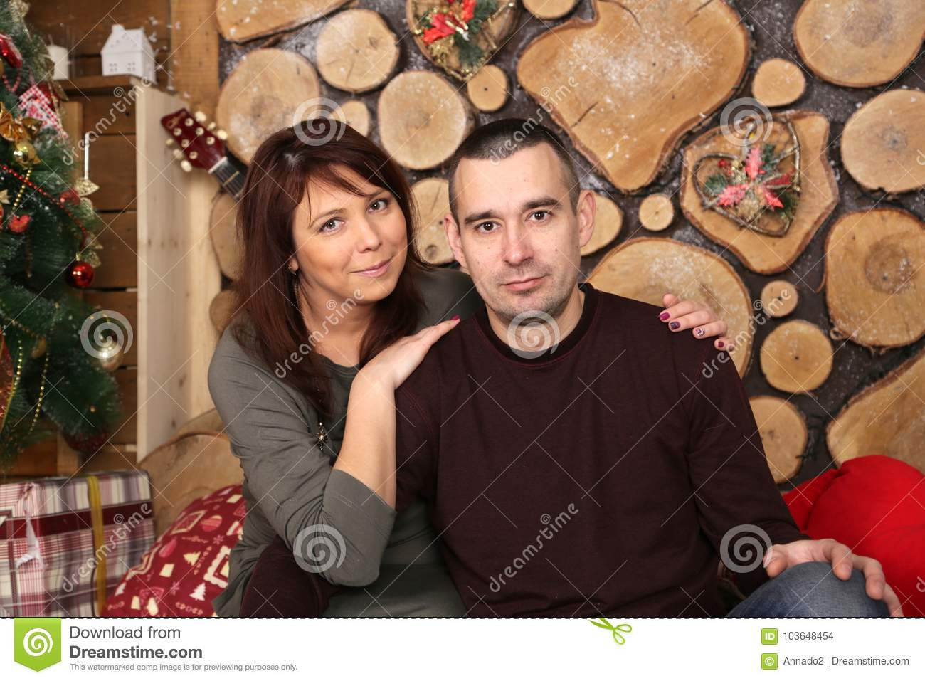 Christmas Gift Ideas For Young Married Couples
 Family Couple At Christmas Tree With Gifts Stock