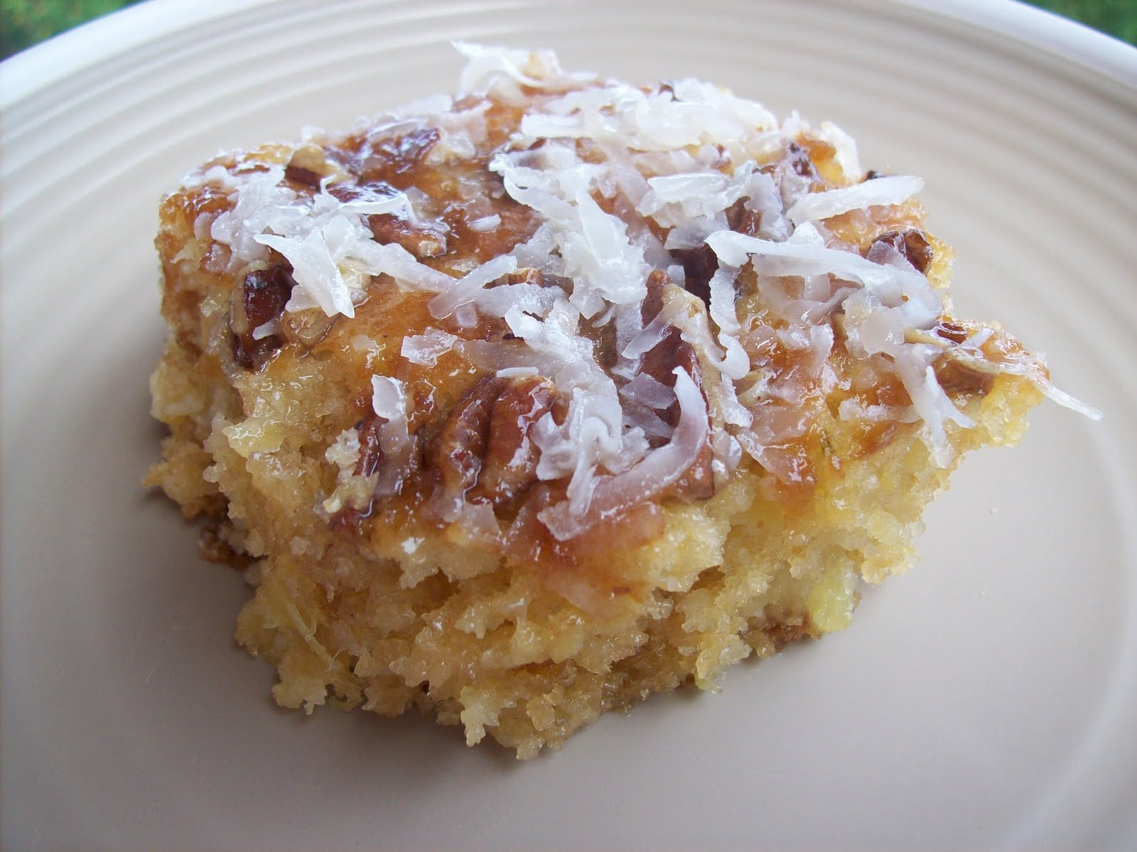 Coconut Pineapple Cake
 Delicious Discoveries Glazed Pineapple Coconut Cake
