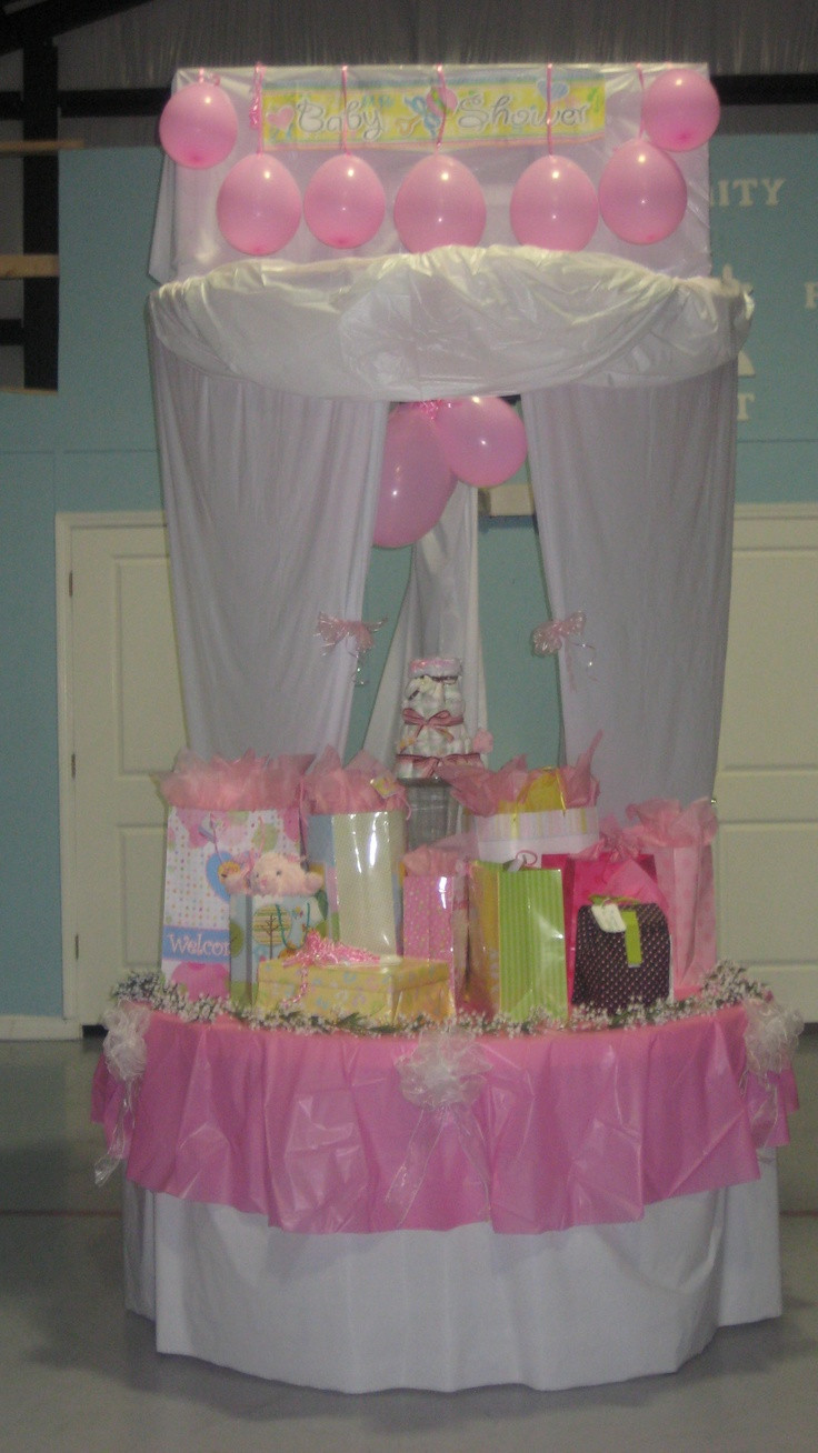 Decorating Ideas For Baby Shower Gift Table
 Baby shower t table decorated over a basketball goal in