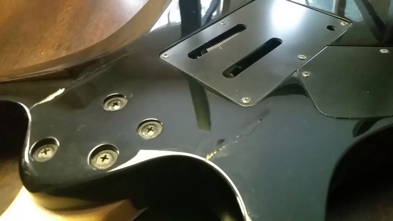 DIY Acoustic Guitar Crack Repair
 DIY Cracked repair in a guitar body 1