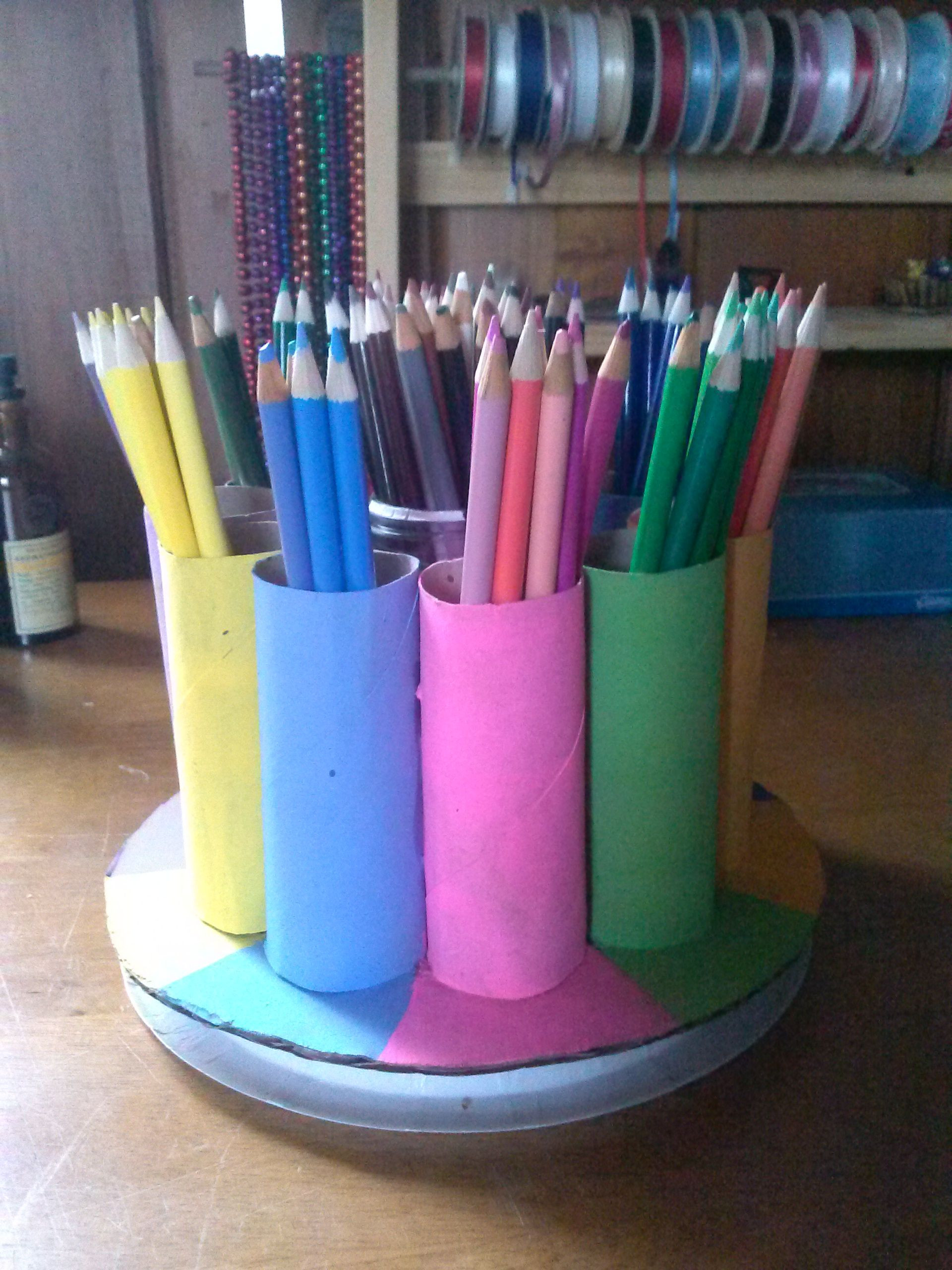 DIY Colored Pencil Organizer
 Painted toilet paper rolls glued to a piece of cardboard