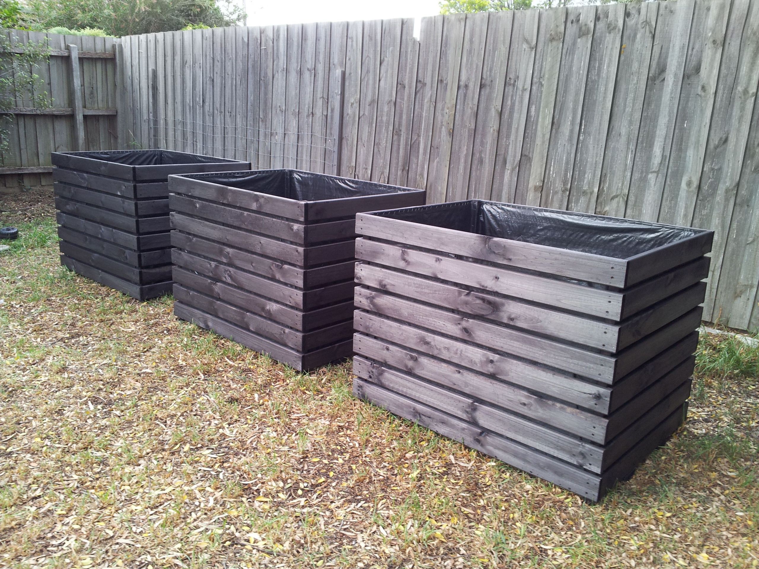 DIY Large Planter Boxes
 Extra large planter boxes stained in black