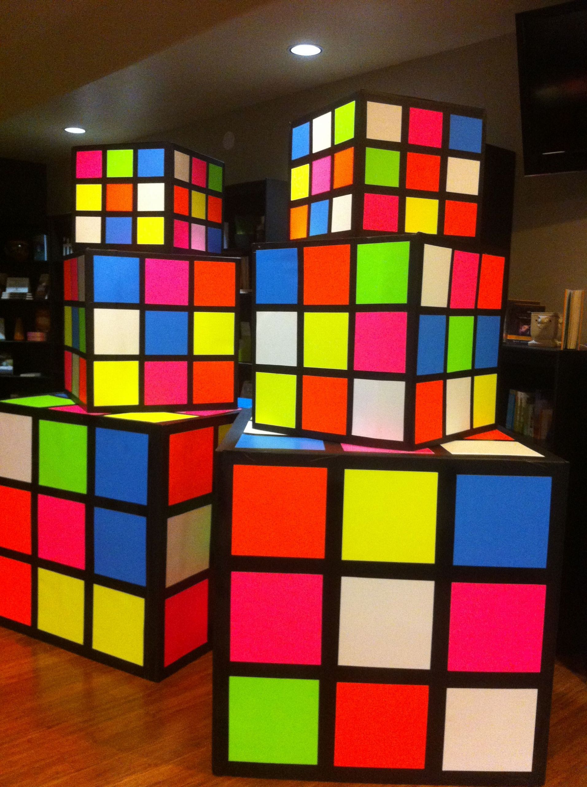 DIY Neon Party Decorations
 Rubik s cubes made from refrigerator boxes black primer