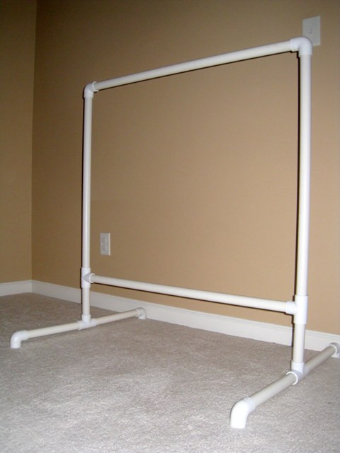 DIY Pvc Clothing Rack
 Four by Two Hanging it up DIY dress up clothes rack