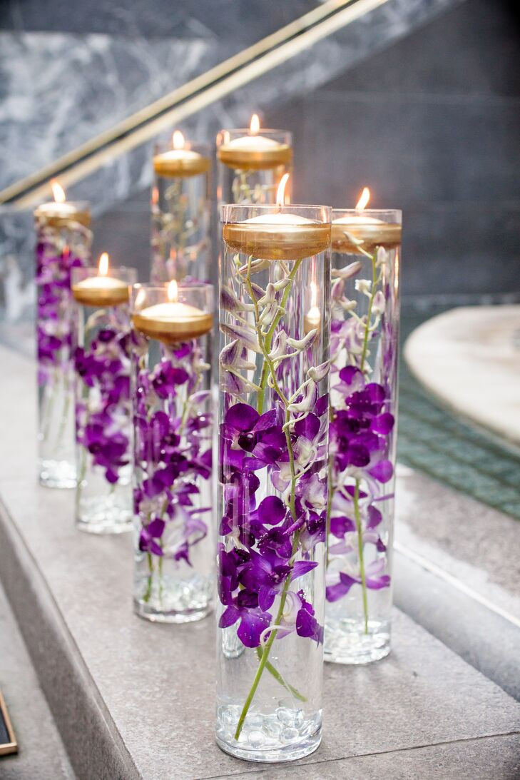 Engagement Party Flower Centerpiece Ideas
 Glass Vases With Purple Orchids and Floating Candles