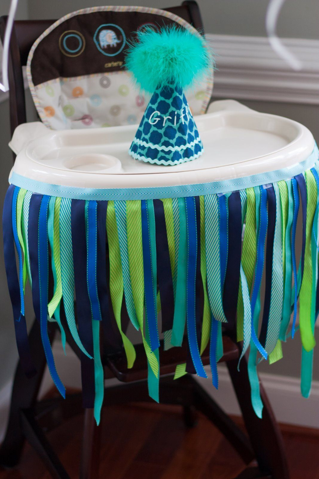 First Birthday High Chair Decorations
 Decorated high chair with ribbon and custom birthday party