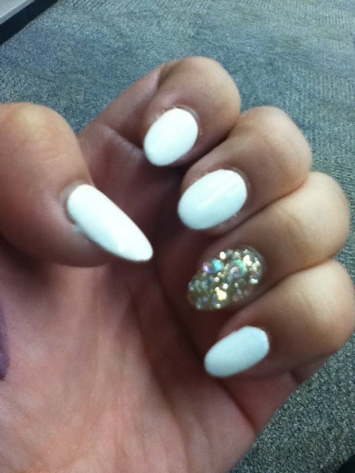 Glitter Almond Nails
 Almond shaped with all white nails and gold glitter assent