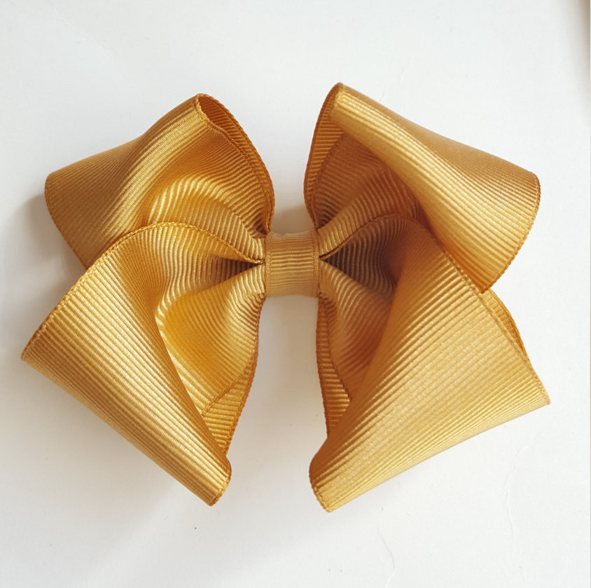 Gold Hair Bow Baby
 Solid gold hair bow boutique baby toddler big girl hair