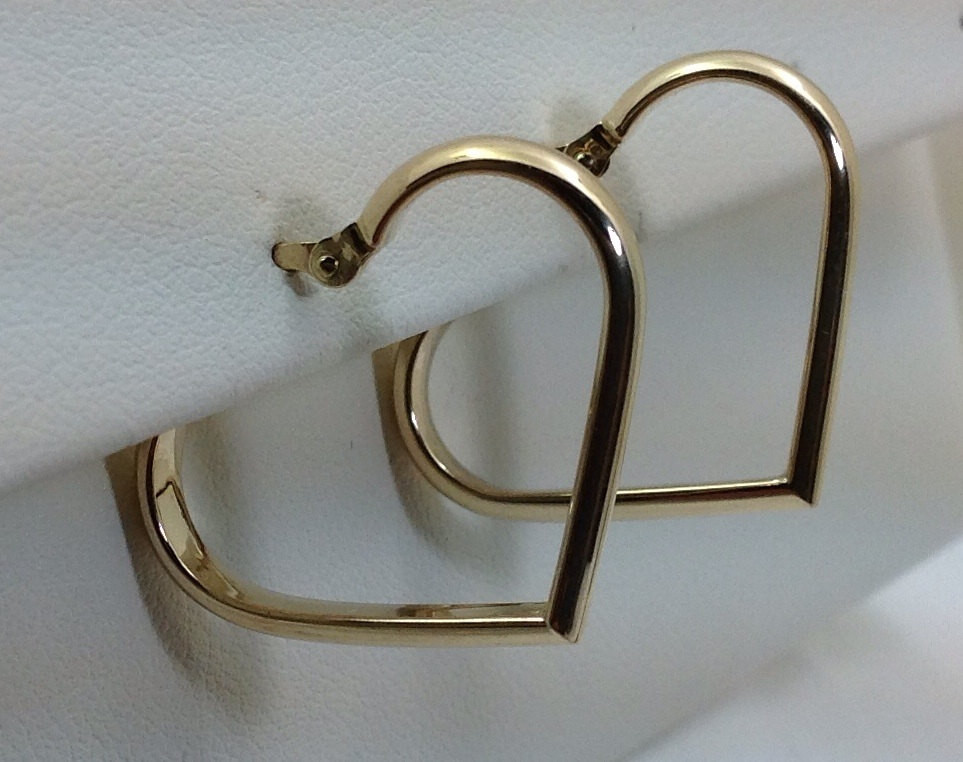 Gold Heart Earrings
 14kt gold heart shaped hoop earrings