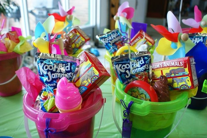 Kids Beach Party Favor Ideas
 sand bucket favors each filled with a juice animal