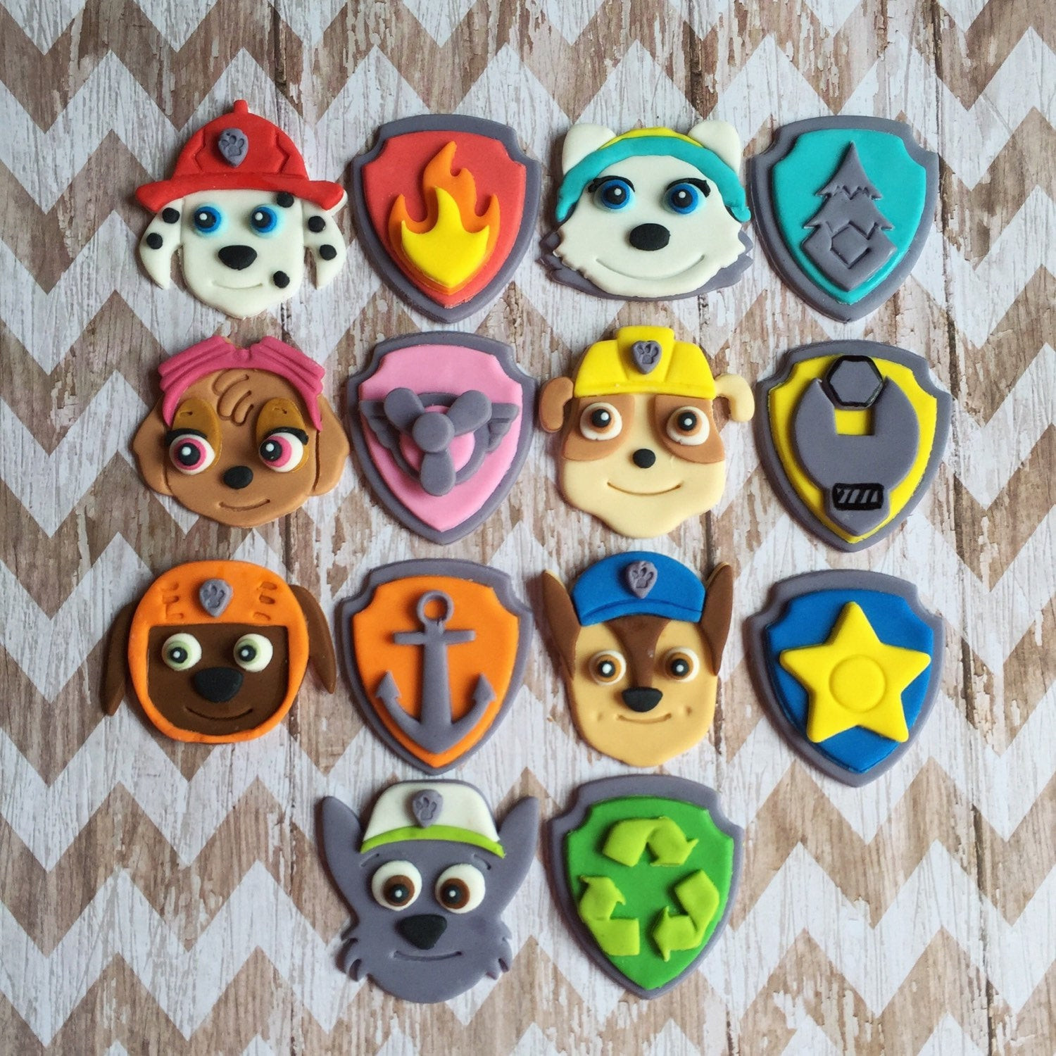 Paw Patrol Cupcakes
 Fondant Paw Patrol cupcake toppers pups and or shield badges