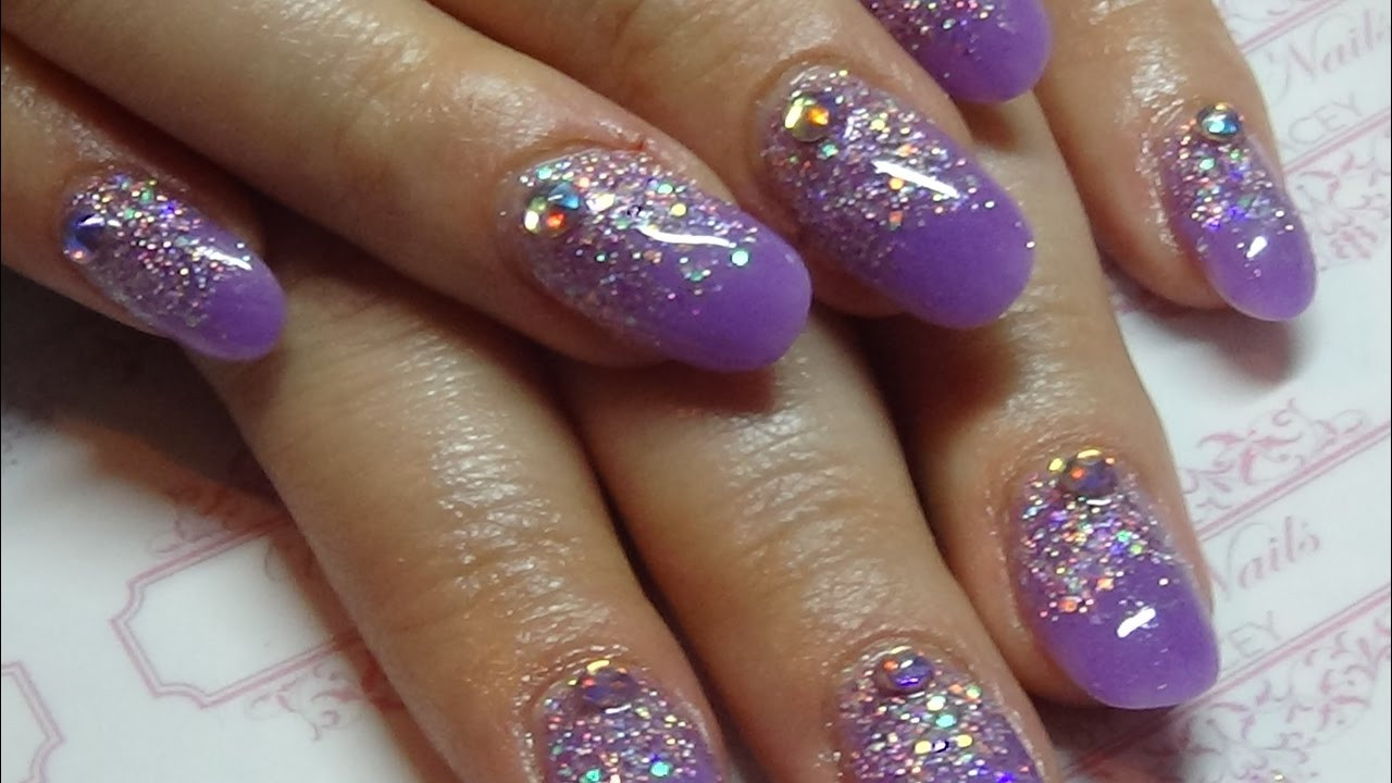 Purple Glitter Acrylic Nails
 Purple acrylic nails with a glitter overlay using cjp