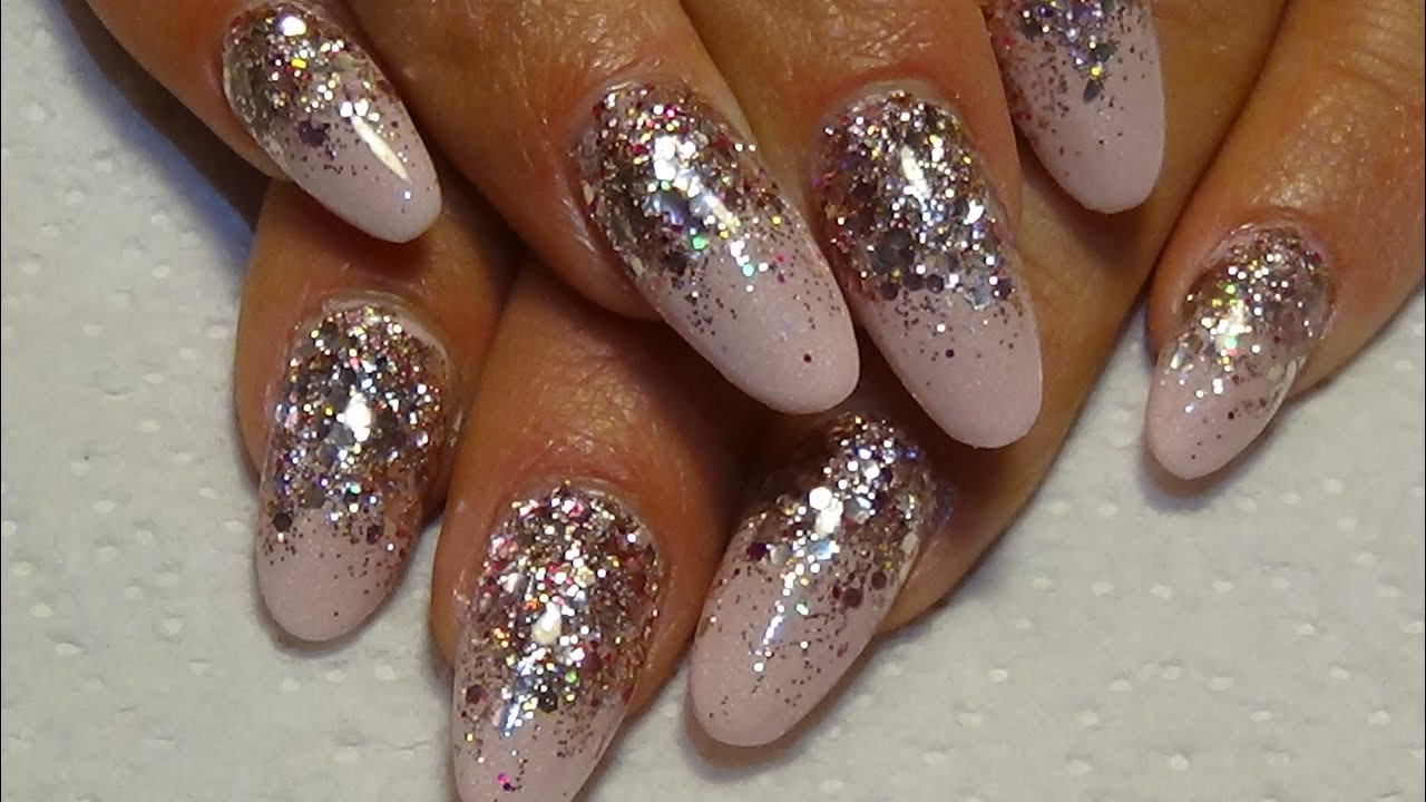Rose Gold Glitter Nails
 pink matalic acrylic nails with rose gold glitter naio