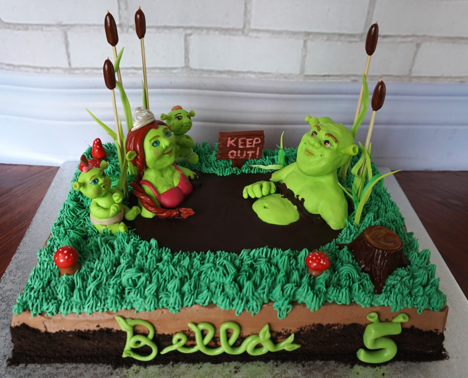Shrek Birthday Cake
 Custom Cakes by Lori Shrek family cake in a mud bath for