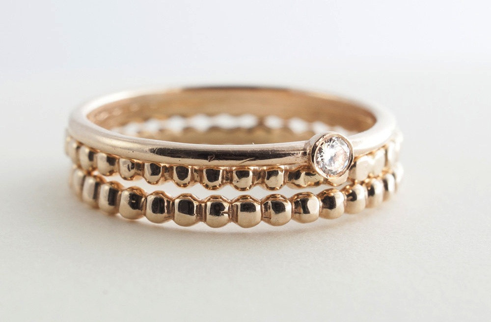 Stackable Diamond Wedding Bands
 Stackable gold wedding bands with single diamond