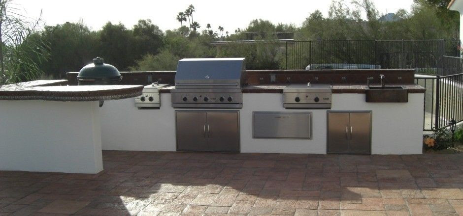 Stucco Outdoor Kitchen
 white stucco outdoor kitchen with dark tiled countertop by