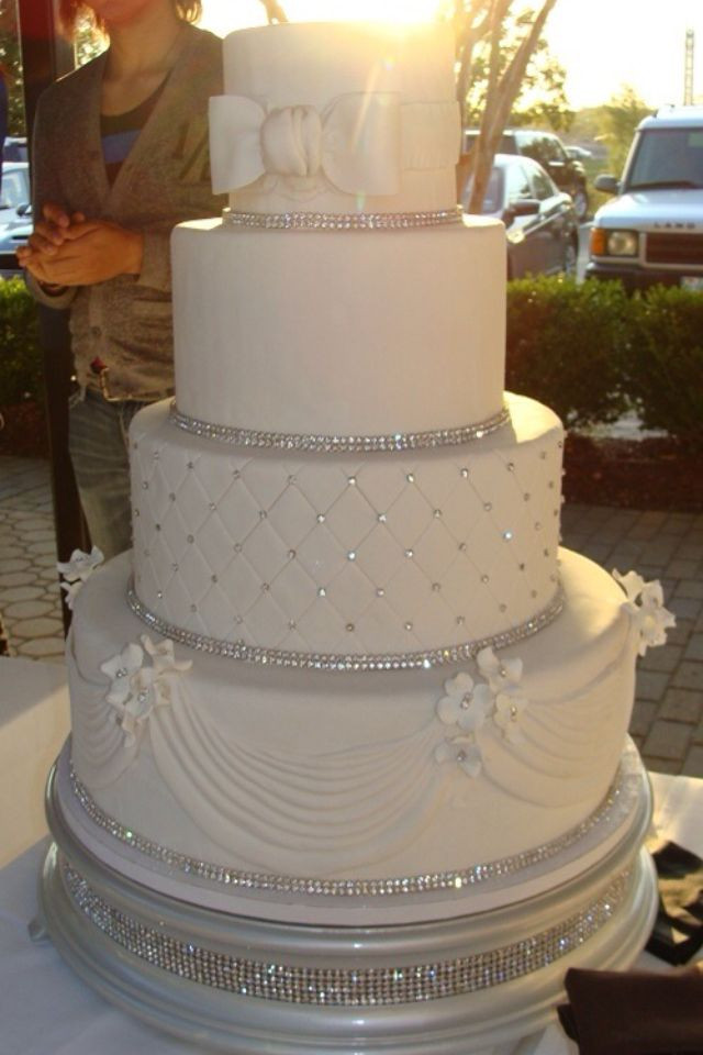 Wedding Cakes With Rhinestones
 Cream colored with GOLD accents instead of silver