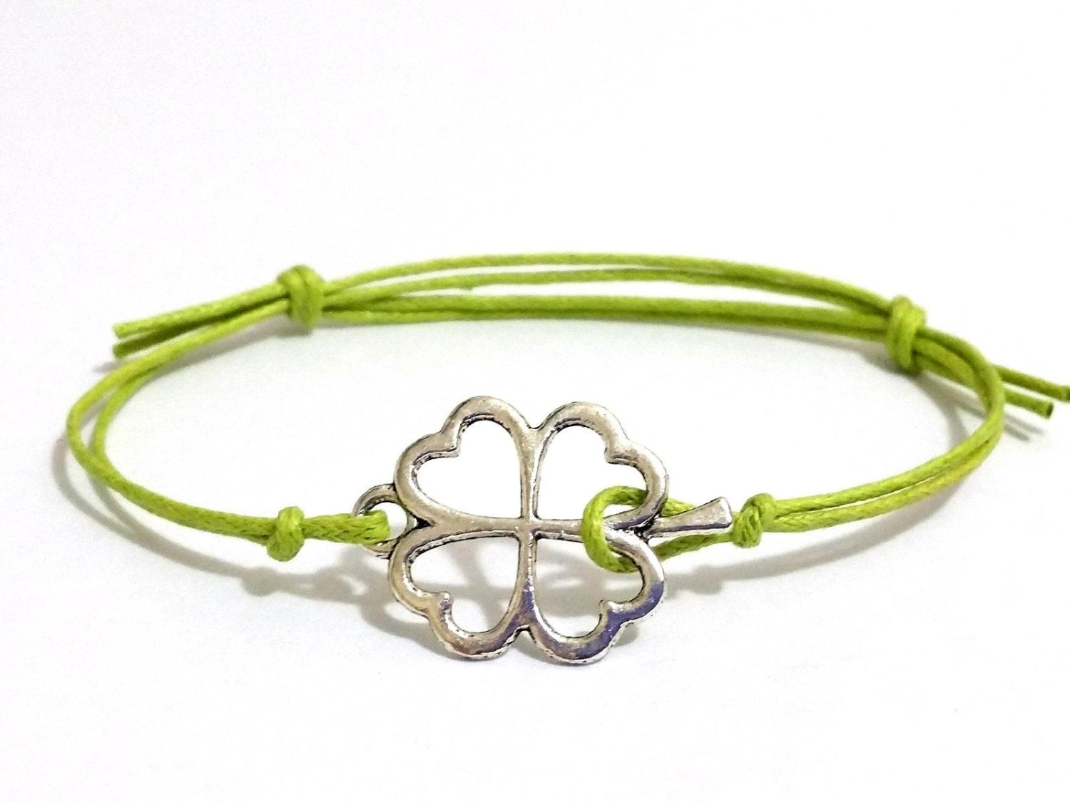 Four Leaf Clover Bracelet
 silver four leaf clover bracelet with bright green wax cord