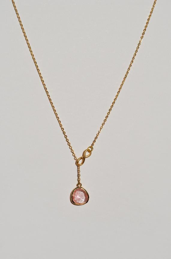Infinity Lariat Necklace
 Gold Infinity Lariat Necklace with Pale Pink Glass by