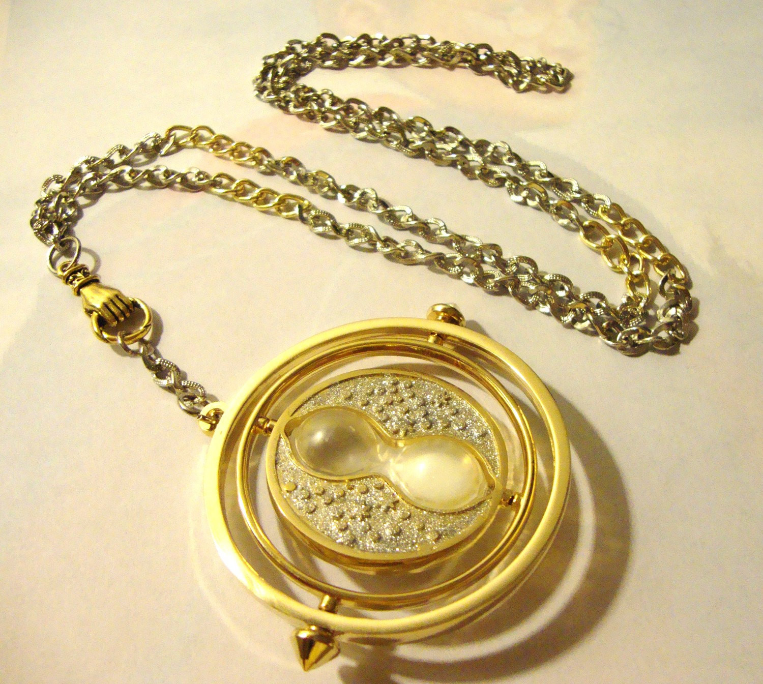 Time Turner Necklace
 Harry Potter Time Turner Necklace in Hand Silver & Gold with